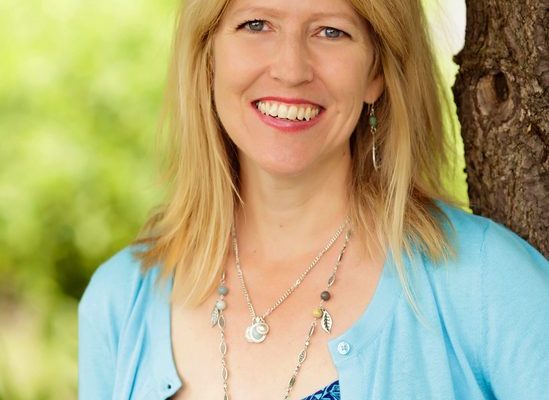Marilee Feldman, Licensed Clinical Professional Counselor and founder of Life Counseling Institute, smiling outdoors in blue top with blue sweater and long necklace.