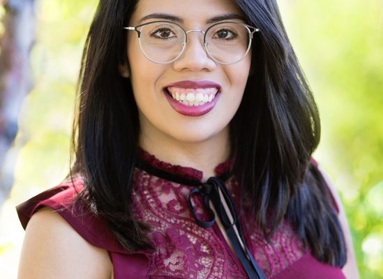 Professional headshot of Zuly Ramirez, therapist, smiling at camera
