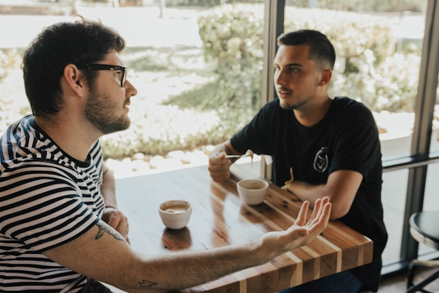 Two men in supportive conversation representing anxiety therapy session in Willowbrook