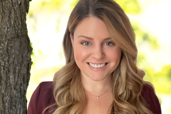 Professional portrait of Eileen Sears, therapist, smiling outdoors