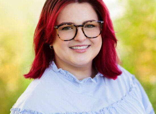 Professional headshot of Emma Williams, therapist, smiling at camera